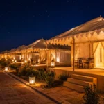Luxury tents illuminated at night in Tent City near White Rann of Kutch during Rann Utsav.